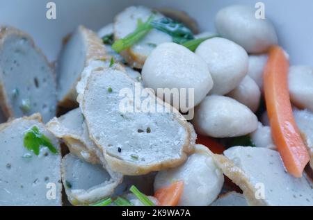 fried slice fish line and ball with carrot on bowl Stock Photo