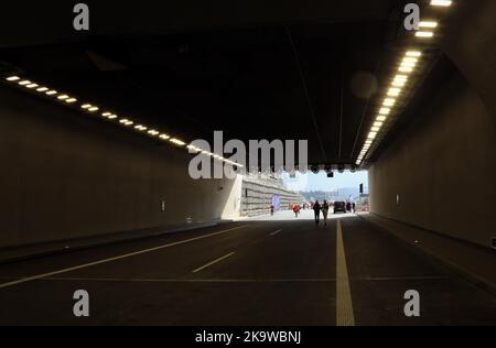 Naprawa. Malopolska. Poland. Road tunnel exit with car and people silhouettes. Stock Photo