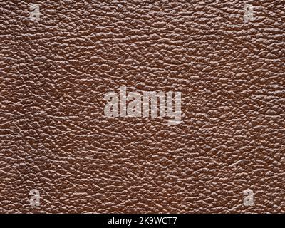 Genuine brown leather, skin natural with design lines pattern or red abstract background. Genuine leather texture. Can use wallpaper or backdrop Stock Photo