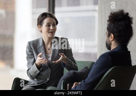 Dialogue of multi ethnic businesspeople in office Stock Photo