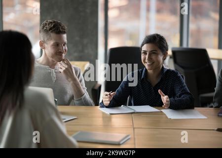 In modern office diverse employees gathered for training or workshop Stock Photo