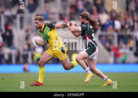 Jamaica’s James Woodburn-Hall attempts to evade the tackle from Lebanon’s Khaled Rajab during the Rugby League World Cup group C match at the Leigh Sports Village, Leigh. Picture date: Sunday October 30, 2022. Stock Photo