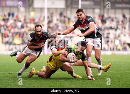 Lebanon’s Khaled Rajab tackles Jamaica’s Alex Young during the Rugby League World Cup group C match at the Leigh Sports Village, Leigh. Picture date: Sunday October 30, 2022. Stock Photo