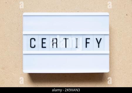Lightbox with word certify on wood background Stock Photo