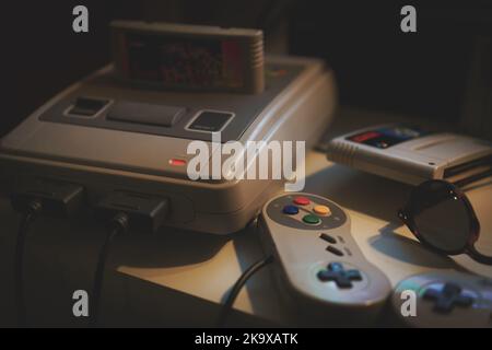 Old popular game console with joysticks. Stock Photo