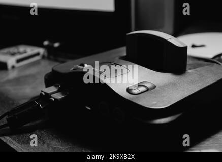 Old popular game console with joysticks. Stock Photo