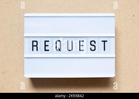 Lightbox with word request on wood background Stock Photo
