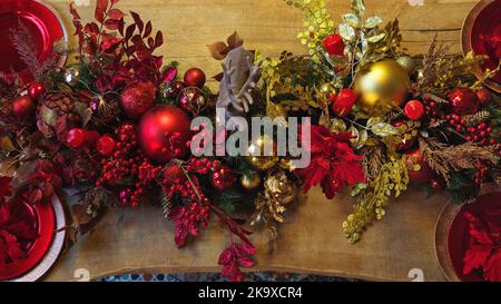 Top view kitchen wooden table or table in living room decorated for holiday. Wallpaper creating atmosphere. Home Christmas and New Year decor. Stock Photo