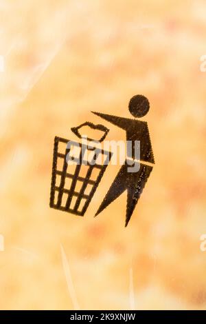 Recycling symbols - Tidyman pictogram - on plastic bag covering of a product box. International recycling symbols, recycling symbol, keep Britain tidy. Stock Photo