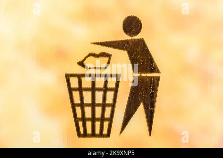 Recycling symbols - Tidyman pictogram - on plastic bag covering of a product box. International recycling symbols, recycling symbol, keep Britain tidy. Stock Photo