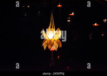 Exterior decoration furniture and art flower flora handmade lamp LED lighting hanging ceiling on roof at outdoor of street market in Loy Krathong and Stock Photo