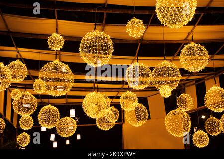 Exterior decoration furniture and art vintage and retro lamp LED lighting hanging ceiling on roof at outdoor of street market in Loy Krathong and cand Stock Photo