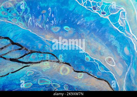 Abstract ocean-ART. Style incorporates the swirls of marble or the ripples of agate. Very beautiful blue paint with the addition of gold powder Stock Photo