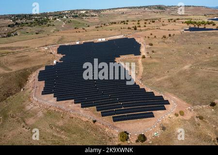 Aerial view of solar panels on a hillside near Thrinia, Paphos district, Cyprus. Stock Photo