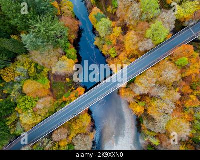 Aerial view of spectacular late autumn colours in trees beside the River Garry near Killiecrankie in Perth and Kinross. Stock Photo