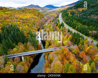 Aerial view of spectacular late autumn colours in trees beside the River Garry near Killiecrankie in Perth and Kinross. Stock Photo