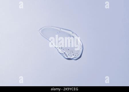 Gel texture swoosh swatch sample cosmetics. Cosmetic gel product with bubbles close up. facial jelly serum, cleanser, shower gel or shampoo Stock Photo