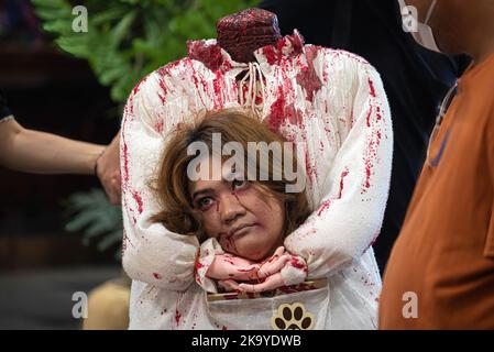 Bangkok, Thailand. 30th Oct, 2022. Dog owner seen dressed in a costume during the Halloween dogs dressing contest at Central Eastville in Bangkok. The event was held to celebrate Halloween festival. (Photo by Peerapon Boonyakiat/SOPA Image/Sipa USA) Credit: Sipa USA/Alamy Live News Stock Photo