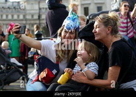 London, UK. 29th Oct, 2022. Women take a selfie during the demonstration. Parents and children took part in Pregnant Then Screwed's ‘March Of The Mummies' in central London demanding better childcare, parental leave and flexible working policies. The protesters marched from Trafalgar Square through Whitehall, passing Downing Street to Parliament Square. (Photo by Steve Taylor/SOPA Images/Sipa USA) Credit: Sipa USA/Alamy Live News Stock Photo