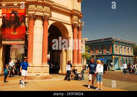 People enjoy a sunny vacation day standing in front of a replica of San Francisco's Palace of Fine Arts at Disneyland California Adventure Stock Photo