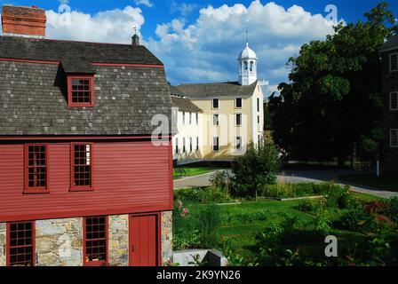 The red historic mills of the Slater Mills Historic site house the first manufacturing and industries in the United States Stock Photo