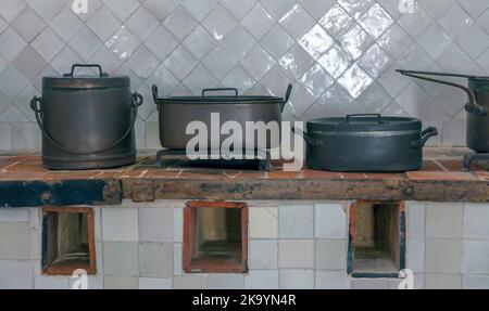 Vintage cooking pots in old kitchen Stock Photo