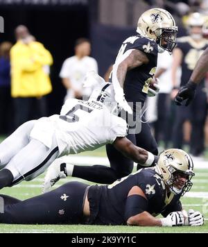 New Orleans, USA. 30th Oct, 2022. New Orleans Saints running back Dwayne Washington (24) tries to get past Las Vegas Raiders linebacker Divine Deablo (5) during a National Football League contest at Caesars Superdome in New Orleans, Louisiana on Sunday, October 30, 2022. (Photo by Peter G. Forest/Sipa USA) Credit: Sipa USA/Alamy Live News Stock Photo