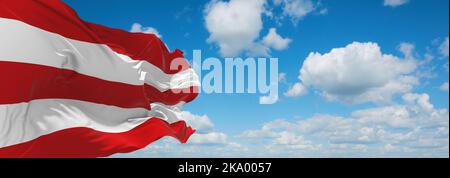 flag of Bora Bora, Australia Oceania at cloudy sky background. flag representing extinct country,ethnic group or culture, regional authorities. copy s Stock Photo