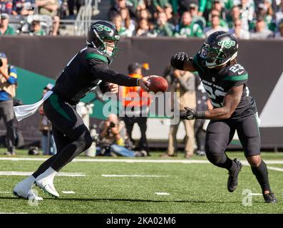 New York Jets' James Robinson (23) dives past Buffalo Bills' Tim Settle  (99) for a touchdown during the second half of an NFL football game,  Sunday, Nov. 6, 2022, in East Rutherford