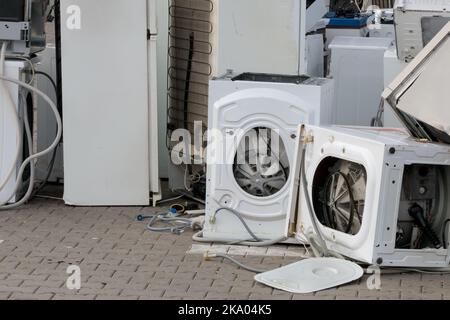 Old and used electrical household waste, returns to the store. Environmental problem, waste disposal. Stock Photo
