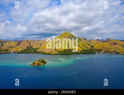 Beautiful aerial view of beaches and tourist boat sailing in Flores Island, Indonesia Stock Photo