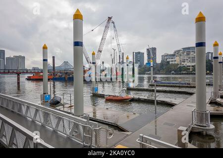 Brisbane, Queensland, Australia - August 2022: Boat moorings and industry together on the Brisbane River. Stock Photo