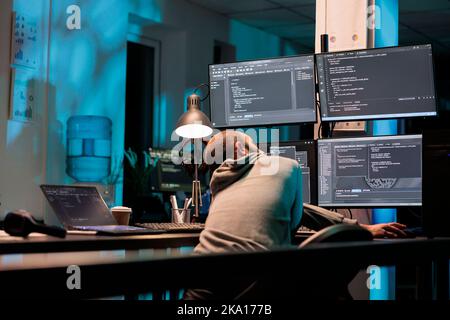 Database admin typing programming code on computer with multiple monitors, working with html script. Developing algorithms for artificial intelligence on terminal window, cloud computing. Stock Photo
