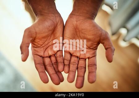 These are how working hands look like. Closeup of an unrecognizable persons open hands stretched out at home during the day. Stock Photo