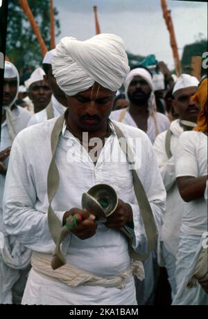 Pandharpur Wari or Wari is a yatra to Pandharpur, Maharashtra, to honor Vithoba. It involves carrying the paduka of a saint in a palkhi, most notably of Dnyaneshwar and Tukaram, from their respective shrines to Pandharpur. Many pilgrims join this procession on foot. Stock Photo