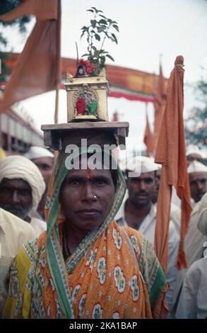 Pandharpur Wari or Wari is a yatra to Pandharpur, Maharashtra, to honor Vithoba. It involves carrying the paduka of a saint in a palkhi, most notably of Dnyaneshwar and Tukaram, from their respective shrines to Pandharpur. Many pilgrims join this procession on foot. Stock Photo