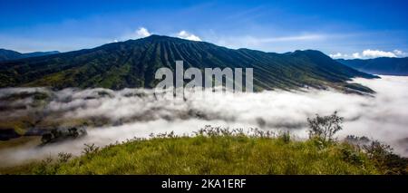 Mountain peaks in morning fog at Bromo Tengger Semeru National Park, Indonesia Stock Photo