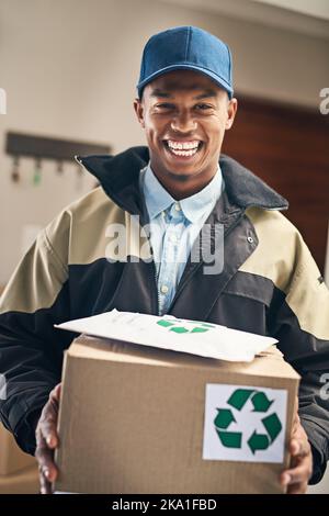 Our priority is getting your parcel delivered safe and sound. Portrait of a courier making a delivery. Stock Photo