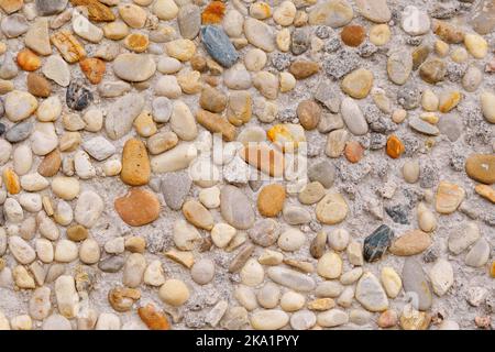 Colored pebble stone wall background. Abstract texture Stock Photo