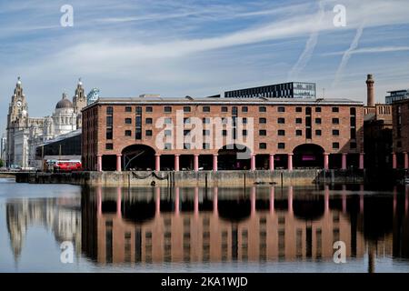 Reflections at Liverpool's Royal  Albert Dock built 1846. The complex houses the largest concentration oif grade 1 listed building in the UK Stock Photo