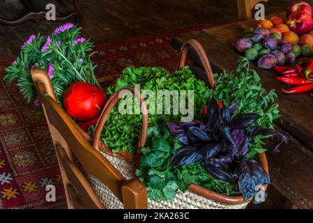 A still life view of fruit and vegetables, in the kitchen of a medieval French chateau. Stock Photo