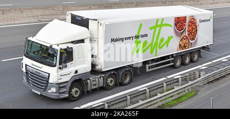 Greencore Irish food company front & side driver cab white DAF CF hgv lorry truck towing rigid body articulated convenience foods delivery trailer UK Stock Photo
