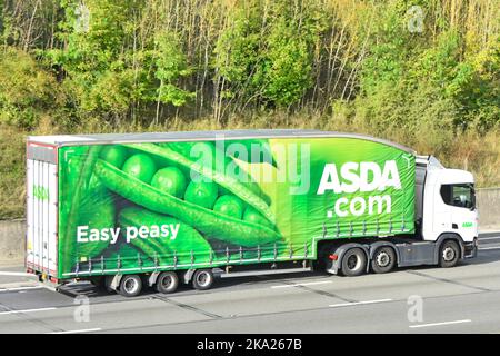 Easy peasy Asda supermarket Scania hgv lorry truck & green pea pod advertising graphic side curtain view articulated trailer driving UK motorway road Stock Photo