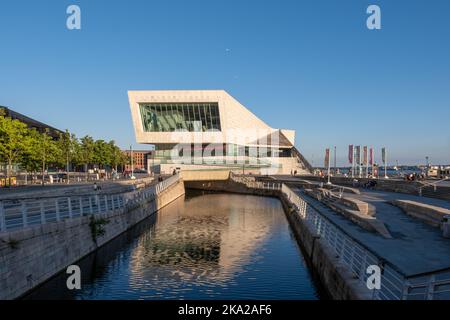 The museum of Liverpool reflected in the canal link in Liverpool, UK on a sunny day Stock Photo