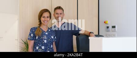 Portrait of dentist posing with nurse in dentists ambulance. Stock Photo
