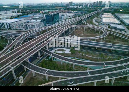 SUZHOU, CHINA - OCTOBER 31, 2022 - Aerial photo taken on Oct 31, 2022 shows vehicles travelling between Suzhou and Kunshan on the full interchange of Stock Photo