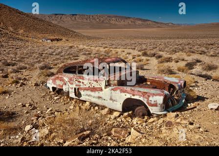 Car wreck at Aquereberry Camp at Eureka Mine, Mojave Desert, Death Valley National Park, California, USA Stock Photo