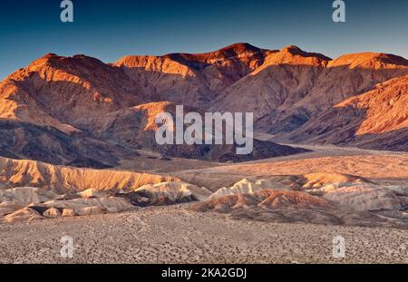 Owlshead Mountains over Confidence Hills in Mojave Desert seen at sunrise from Jubilee Pass Road, Death Valley National Park, California, USA Stock Photo