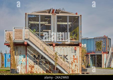 Almere, The Netherlands - April 21, 2022: Tiny offices made of used steel cargo containers in Almere, The Netherlands Stock Photo