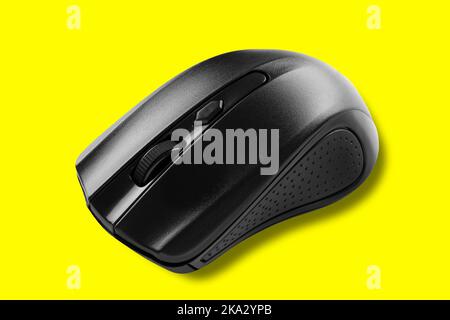 Gray modern computer wireless mouse. Isolated on yellow background. Stock Photo